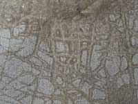 Varnish penetrating to the canvas through cracks in the paint and ground layers