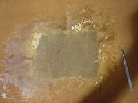 Wax patch on backside of painting during removal